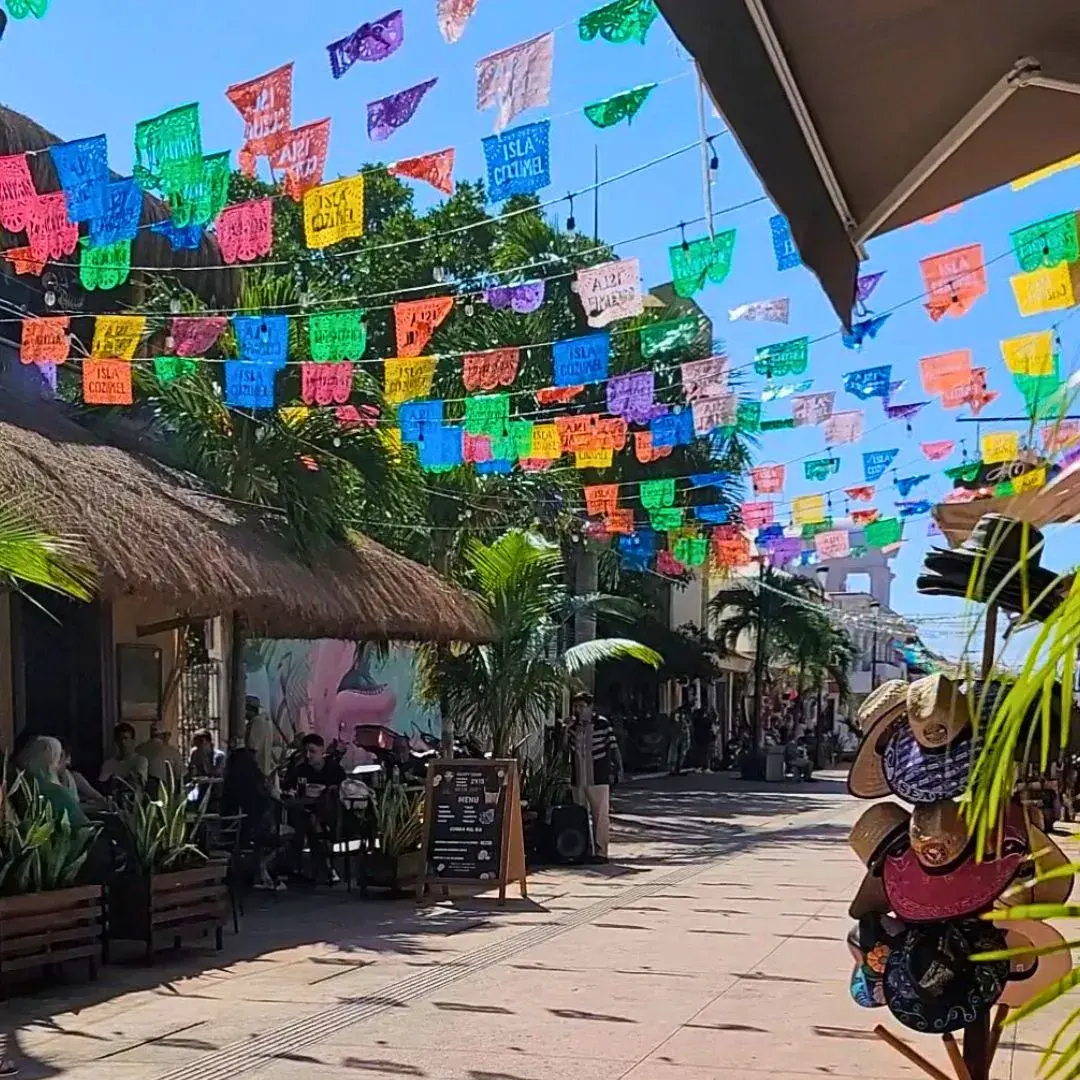 Lively and colorful shopping street in Cozumel, Mexico.
