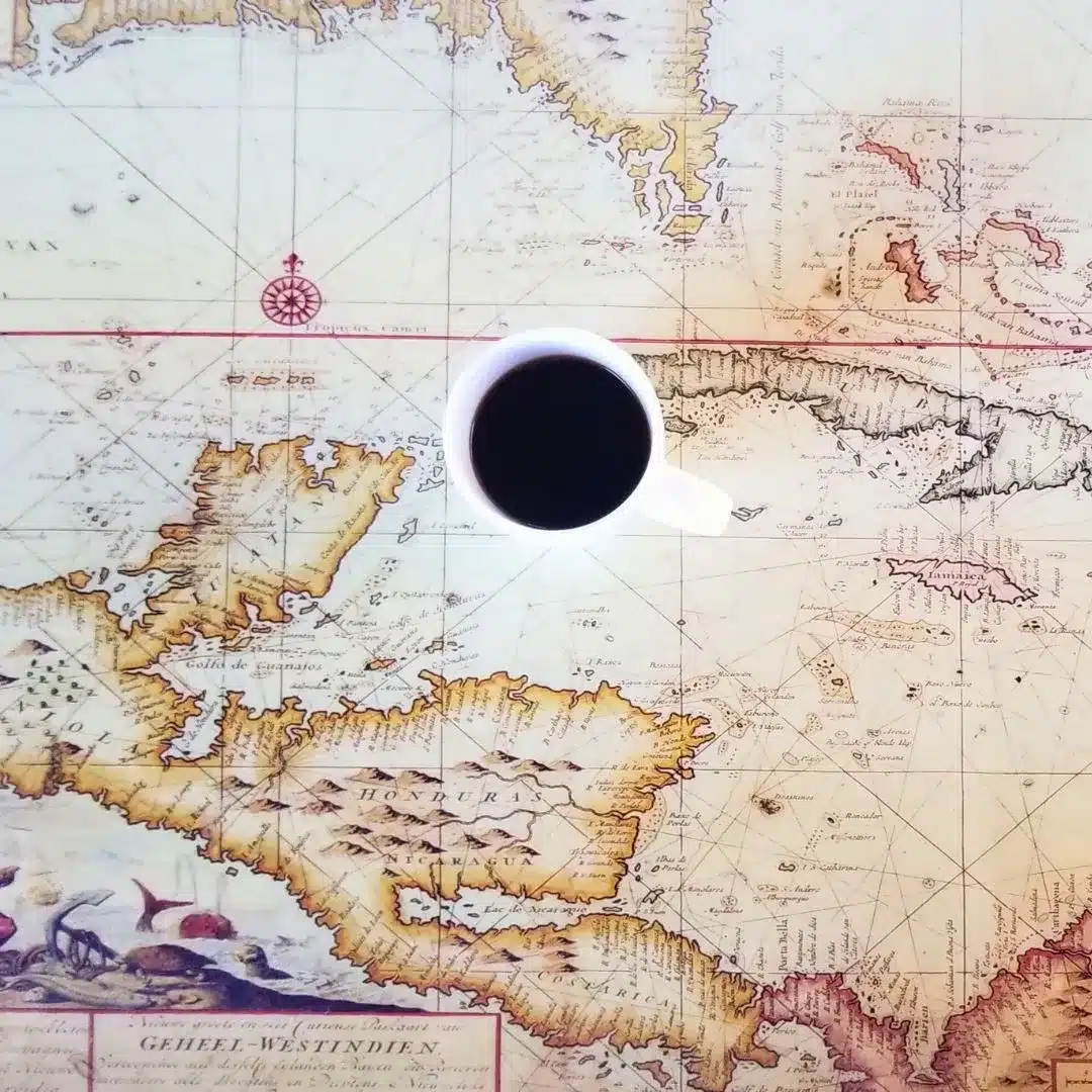 Coffee cup on a map, ready for a day of exploration.