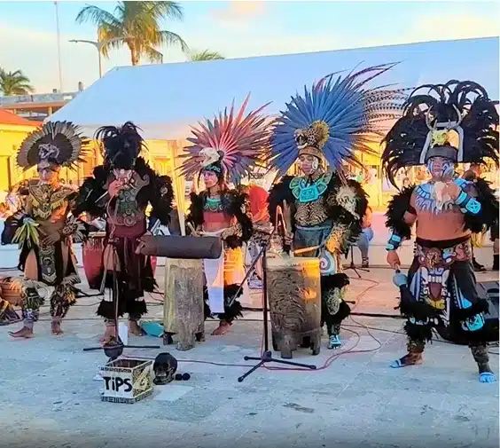 Performers in traditional attire at a Cozumel festival of the sun.